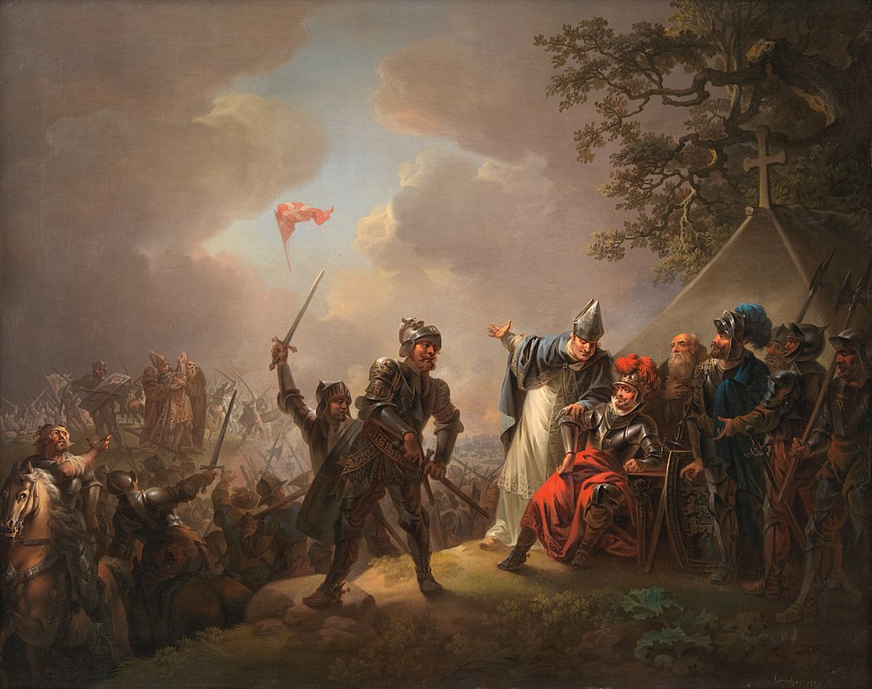 Apparition du drapeau danois lors de la bataille de Lyndanisse, entre le roi Valdemar le Victorieux et les Estoniens, le 15 juin 1219.