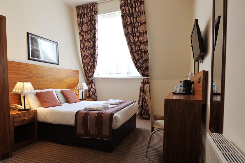 Chambre simple mais agréable de l'hotel Alexander Thomson à Glasgow.