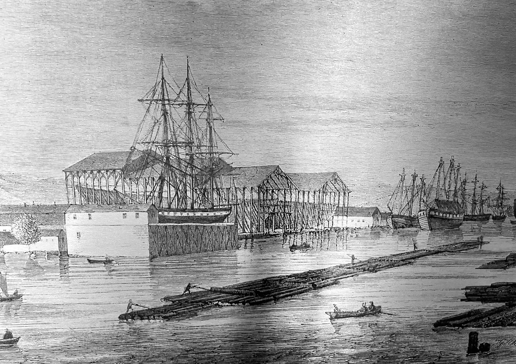Chantier naval de Danzig en 1861. Conformément aux règlements des autorités militaires, la zone du chantier naval royal, située à proximité immédiate des remparts de la ville, ne pouvait initialement être aménagée qu'avec des structures en bois, faciles à démolir en cas de menace.