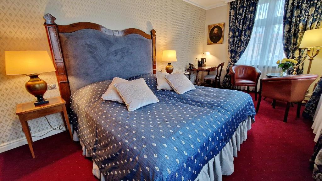 Chambre de l'hotel Podewils à Gdansk.