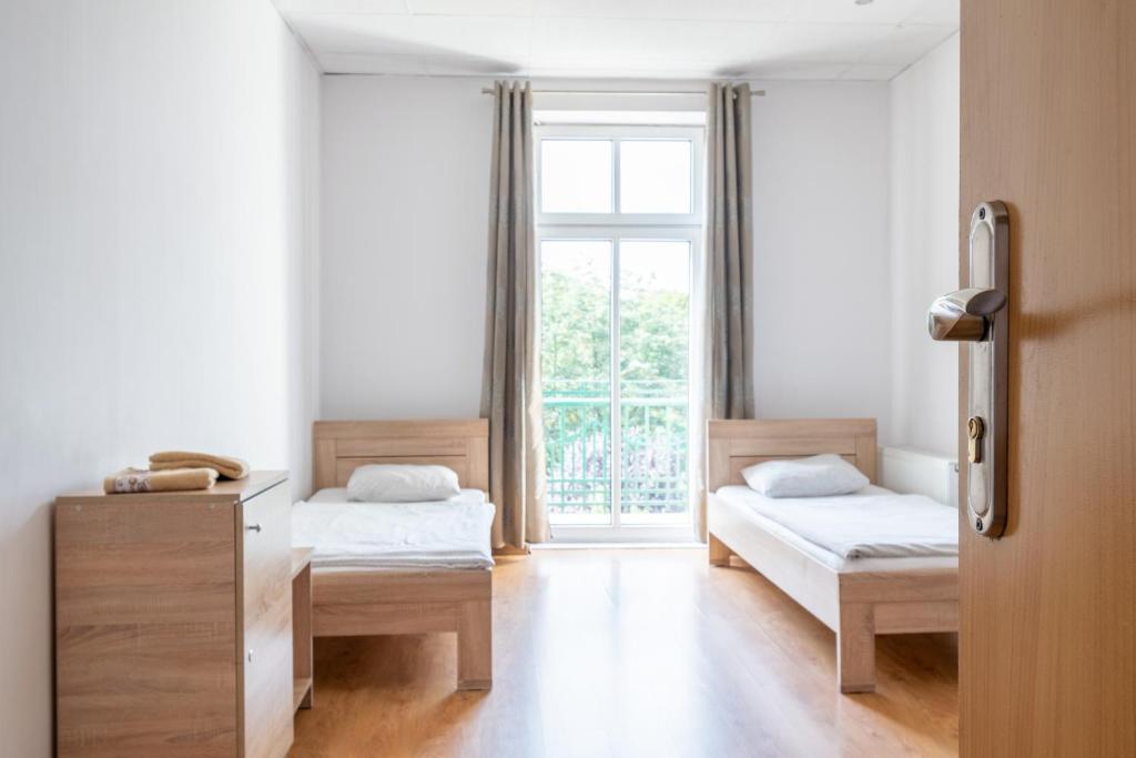 Chambre privative de l'auberge Hostel Katowice Centrum.