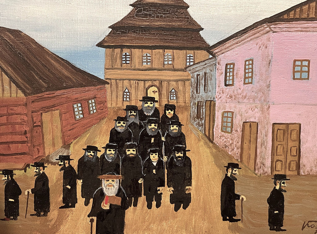 Toile de Kostur Karol "Devant la synagogue" ("Przed synagoga) (1984). Musée ethnographie de Cracovie.