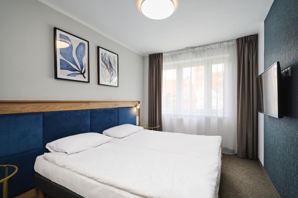 Chambre de l'Hotel Halo à Torun.