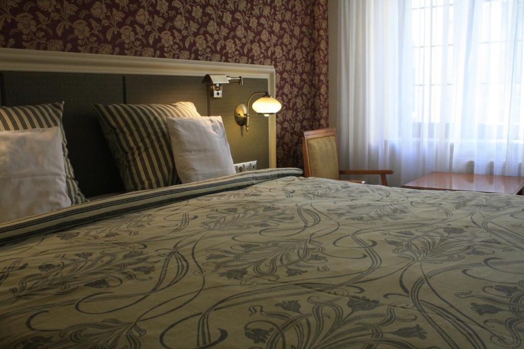Chambre de l'Hotel Petite Fleur à Torun.