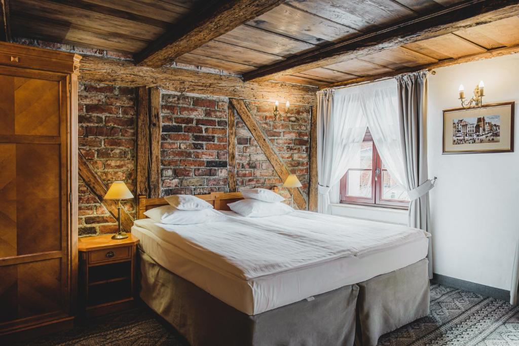 Chambre de l'Hotel Solaris à Torun.
