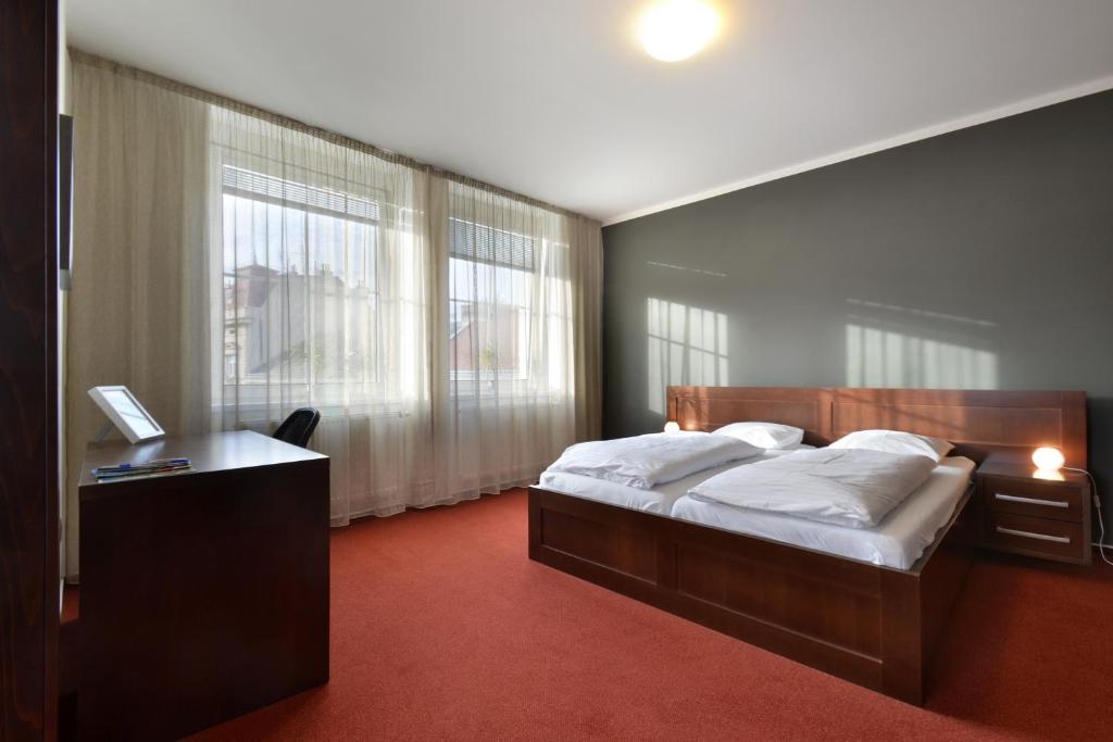 Chambre de l'Hotel Palac à Olomouc.