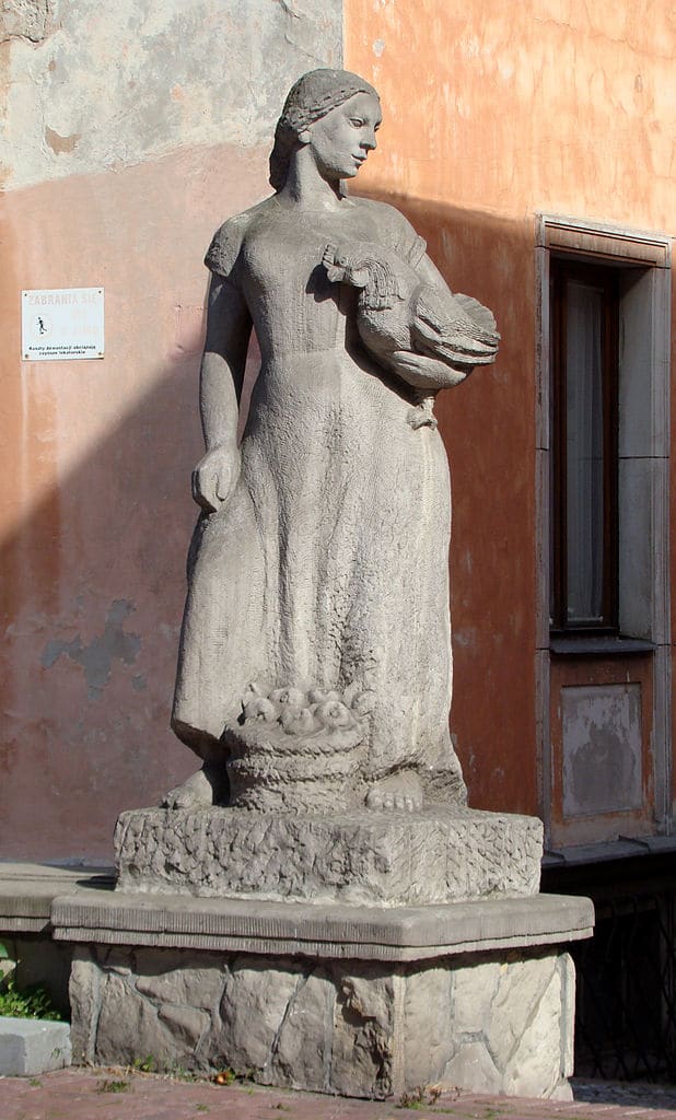 Statue de Barbara Zbrożyna d'une marchande avec une poule. dans le quartier de Mariensztat à Varsovie - Photo de Szczebrzeszynski